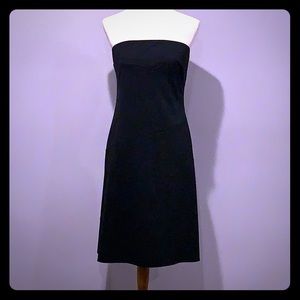 Mid length black dress.